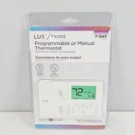 Lux Programmable Thermostat 7-DAY Backlit Digital White TX100E New Nib. Fixed Price $29.85.